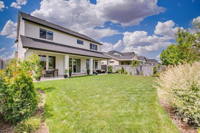 back of property with a patio area