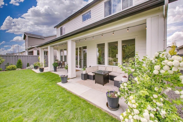 rear view of house with a patio and outdoor lounge area