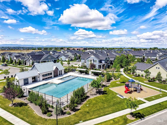 aerial view of residential area featuring a pool area