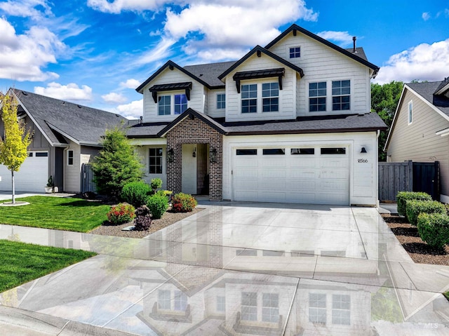 view of front facade with concrete driveway and a garage
