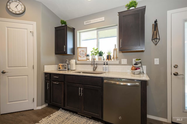 kitchen featuring a sink, dark brown cabinets, and stainless steel dishwasher