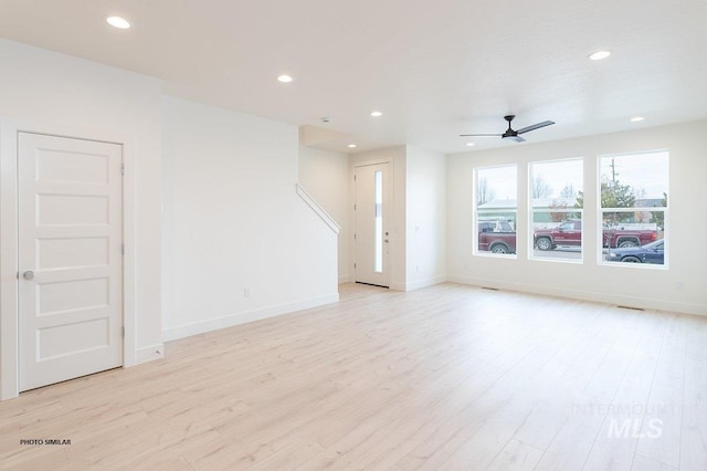 1327 N Webb Way, Meridian, ID 83642 - unfurnished living room featuring light wood-style floors, recessed lighting, baseboards, and ceiling fan