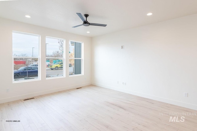1327 N Webb Way, Meridian, ID 83642 - spare room with light wood finished floors, baseboards, a ceiling fan, and recessed lighting