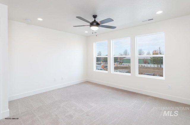 1327 N Webb Way, Meridian, ID 83642 - empty room featuring light carpet, baseboards, recessed lighting, ceiling fan, and a smoke detector