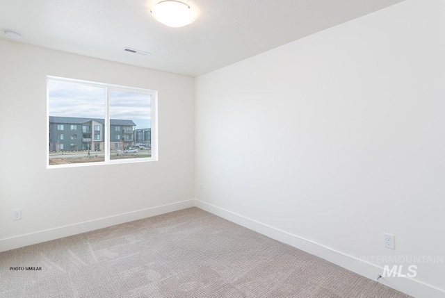 1327 N Webb Way, Meridian, ID 83642 - unfurnished room featuring carpet floors, baseboards, and a smoke detector
