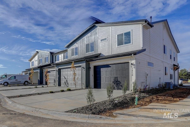 1327 N Webb Way, Meridian, ID 83642 - view of front of property featuring a garage, cooling unit, and driveway