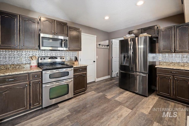 2123 E 3970 N, Filer, ID 83328 - kitchen featuring stainless steel appliances, decorative backsplash, dark brown cabinetry, and recessed lighting