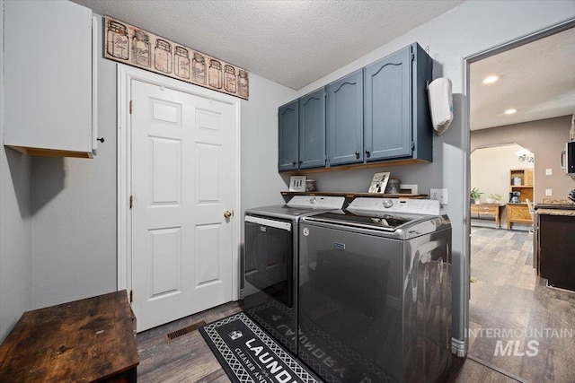 2123 E 3970 N, Filer, ID 83328 - laundry room with washer and clothes dryer, cabinet space, dark wood-style floors, a textured ceiling, and recessed lighting