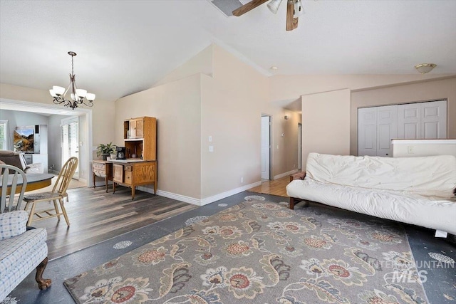 2123 E 3970 N, Filer, ID 83328 - bedroom featuring vaulted ceiling, a chandelier, wood finished floors, baseboards, and ceiling fan