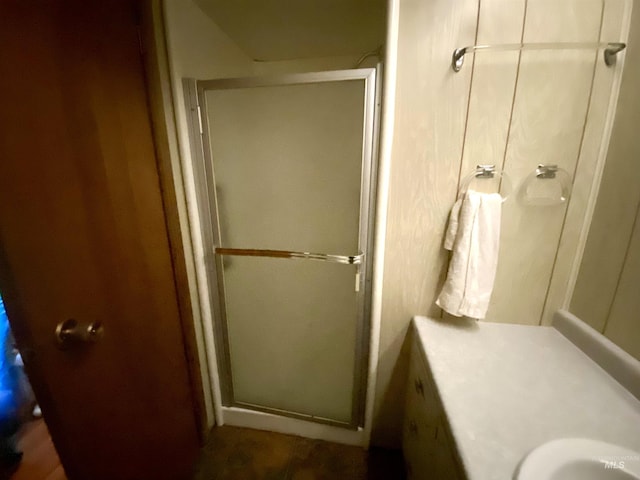 bathroom with a shower with shower door