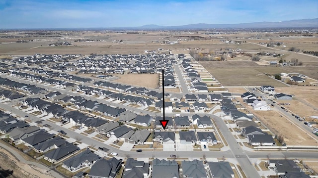 bird's eye view with a mountain view and a residential view