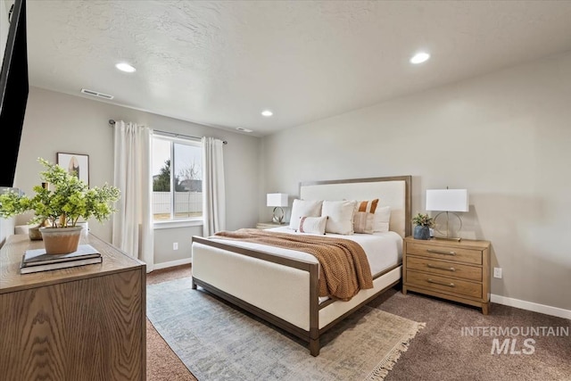 carpeted bedroom with baseboards, visible vents, a textured ceiling, and recessed lighting