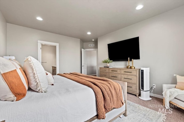 bedroom featuring recessed lighting, light colored carpet, and baseboards