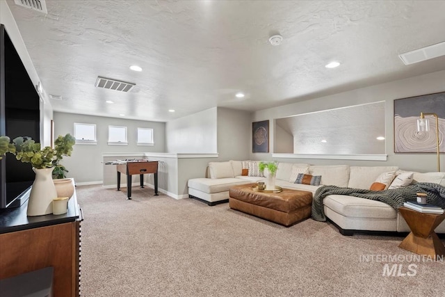 living room with recessed lighting, carpet flooring, visible vents, and baseboards