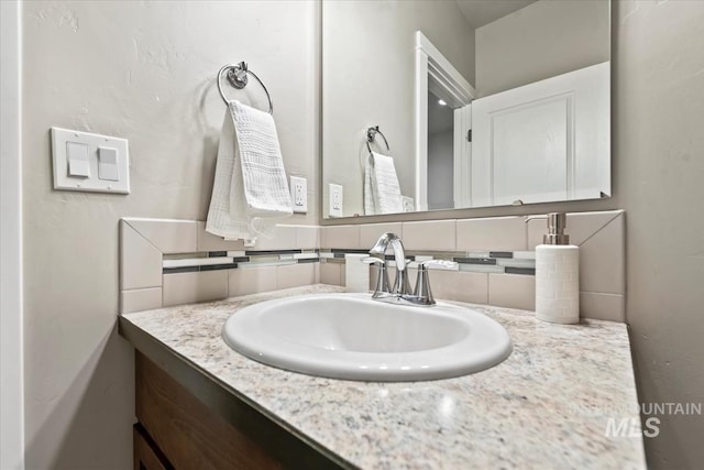 bathroom with backsplash and vanity