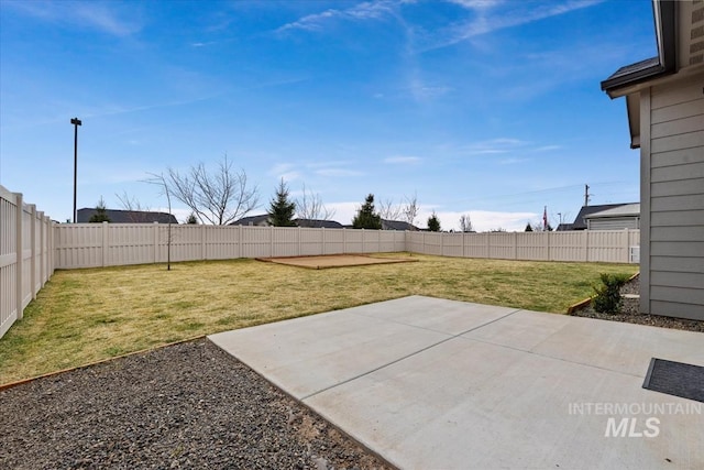 view of yard featuring a patio area and a fenced backyard