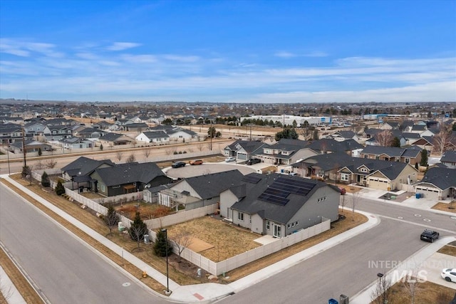 birds eye view of property with a residential view