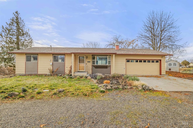 ranch-style house featuring a garage