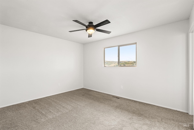 unfurnished room featuring carpet and ceiling fan