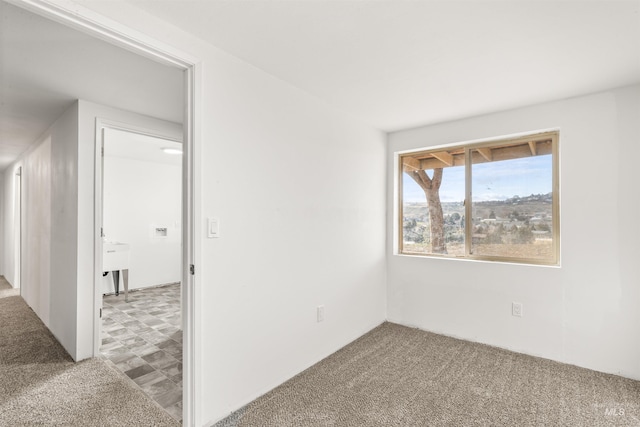 unfurnished room with carpet floors