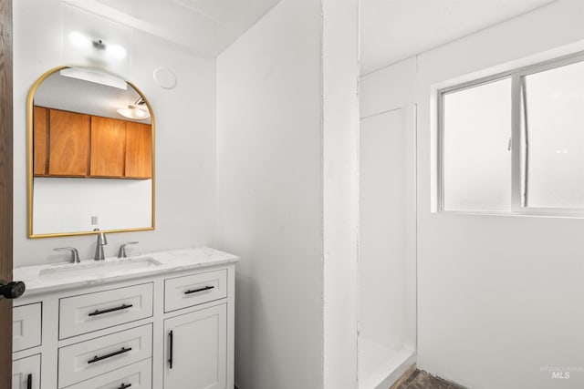 bathroom with vanity and walk in shower