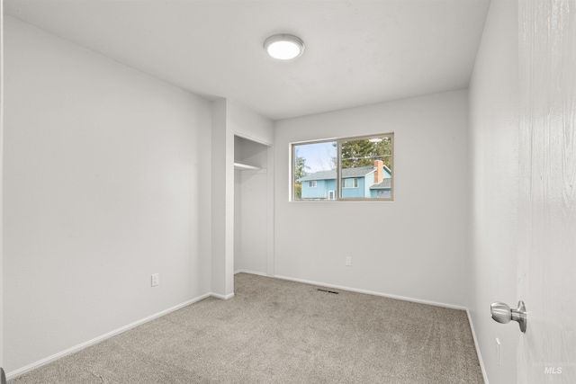 unfurnished room with carpet floors