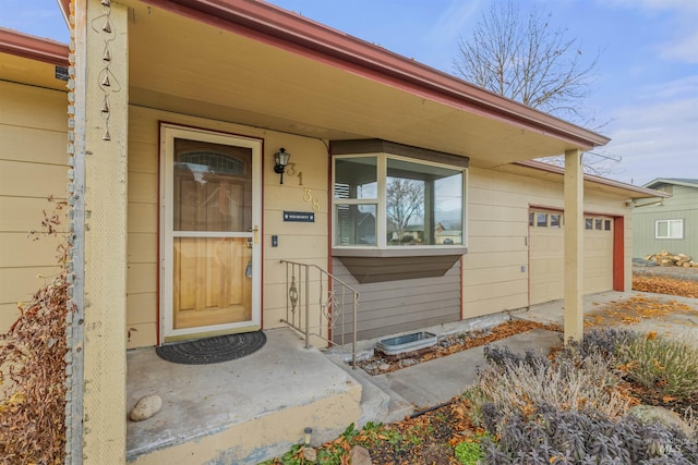 property entrance with a garage