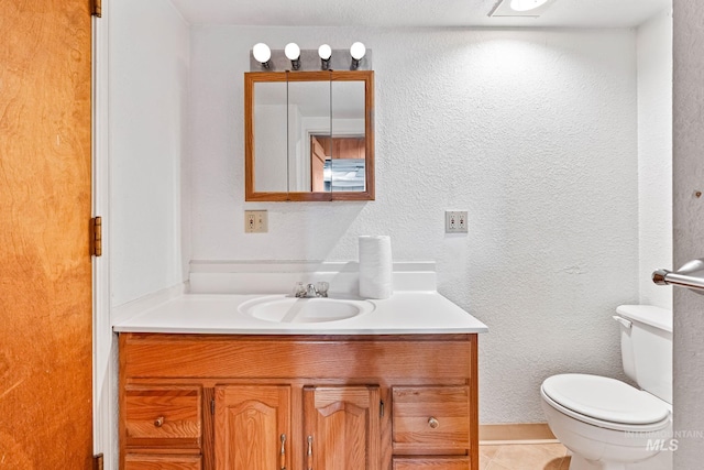404 N Allumbaugh St, Boise, ID 83704 - bathroom with vanity, toilet, a textured wall, and tile patterned floors