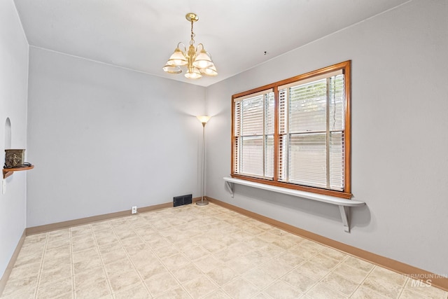 404 N Allumbaugh St, Boise, ID 83704 - unfurnished room featuring a chandelier, baseboards, and light flooring