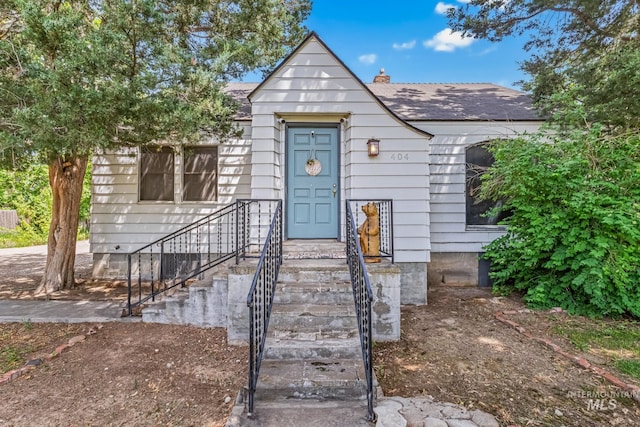 404 N Allumbaugh St, Boise, ID 83704 - view of front facade with a shingled roof and a chimney