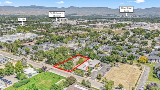 404 N Allumbaugh St, Boise, ID 83704 - aerial view of property and surrounding area with property parcel outlined and a mountainous background