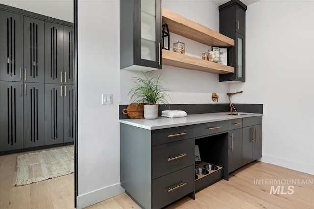 6162 N High Valley Way, Boise, ID 83714 - bar with baseboards and light wood-type flooring