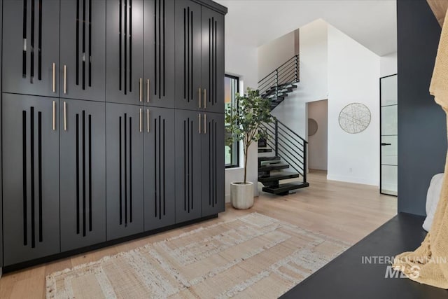 6162 N High Valley Way, Boise, ID 83714 - foyer featuring stairs, light wood-style floors, and baseboards