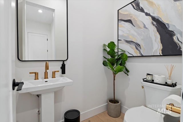 6162 N High Valley Way, Boise, ID 83714 - half bath featuring toilet, baseboards, and wood finished floors