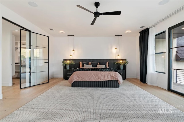 6162 N High Valley Way, Boise, ID 83714 - bedroom featuring light wood finished floors, baseboards, and ceiling fan
