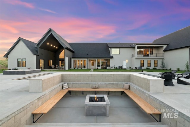 6162 N High Valley Way, Boise, ID 83714 - rear view of house with a fire pit, a patio area, and stucco siding