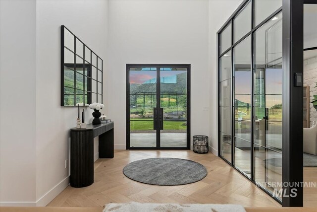 6162 N High Valley Way, Boise, ID 83714 - doorway to outside with french doors, a towering ceiling, and baseboards