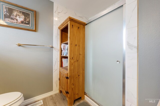 bathroom featuring vanity, shower / bath combo, and tile patterned flooring