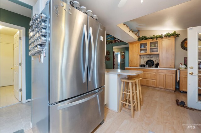 interior space featuring light tile patterned flooring and ceiling fan