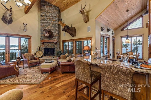 516 Whitewater Dr, Donnelly, ID 83615 - living room featuring high vaulted ceiling, wooden ceiling, sink, and dark wood-type flooring