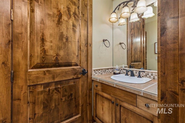 516 Whitewater Dr, Donnelly, ID 83615 - bathroom featuring wooden walls and vanity