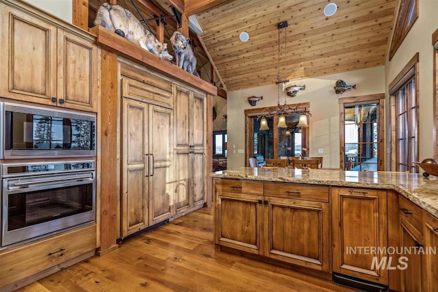 516 Whitewater Dr, Donnelly, ID 83615 - kitchen with pendant lighting, wooden ceiling, black microwave, stainless steel oven, and wood-type flooring