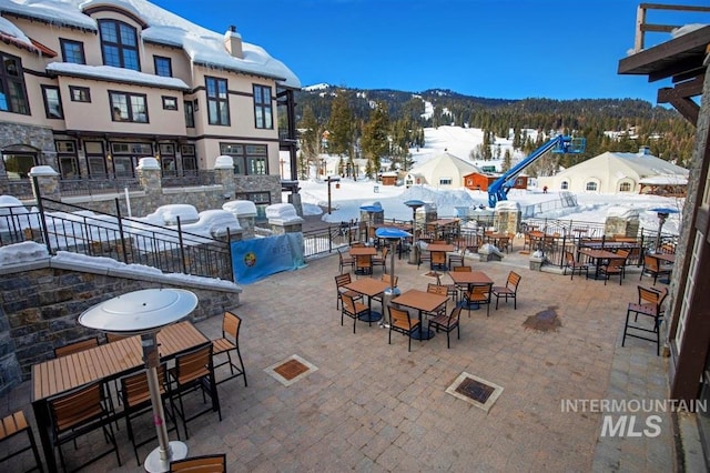 516 Whitewater Dr, Donnelly, ID 83615 - snow covered patio with a mountain view