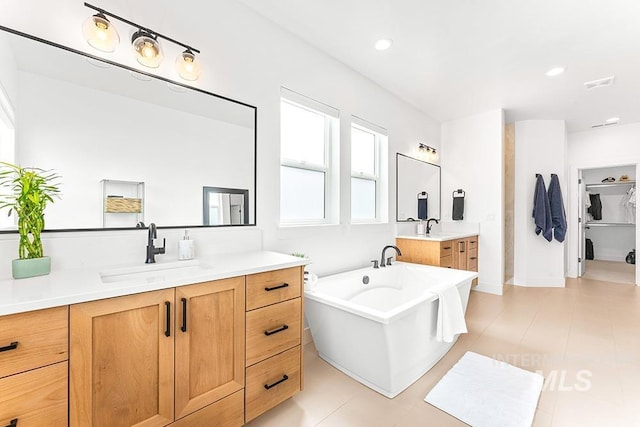 3012 E Parulo Dr, Meridian, ID 83642 - bathroom with a soaking tub, two vanities, a sink, visible vents, and recessed lighting