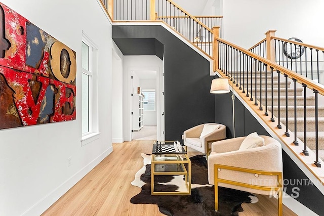 3012 E Parulo Dr, Meridian, ID 83642 - sitting room featuring stairs, wood finished floors, and baseboards