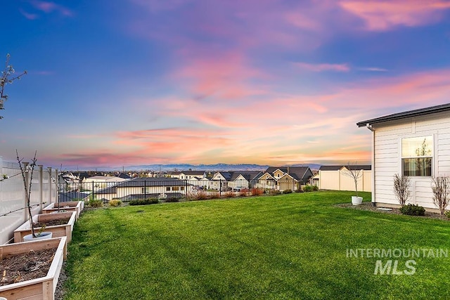 3012 E Parulo Dr, Meridian, ID 83642 - view of yard featuring a fenced backyard and a vegetable garden