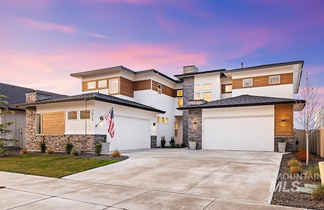 3012 E Parulo Dr, Meridian, ID 83642 - view of front of house featuring driveway, stone siding, a chimney, an attached garage, and stucco siding