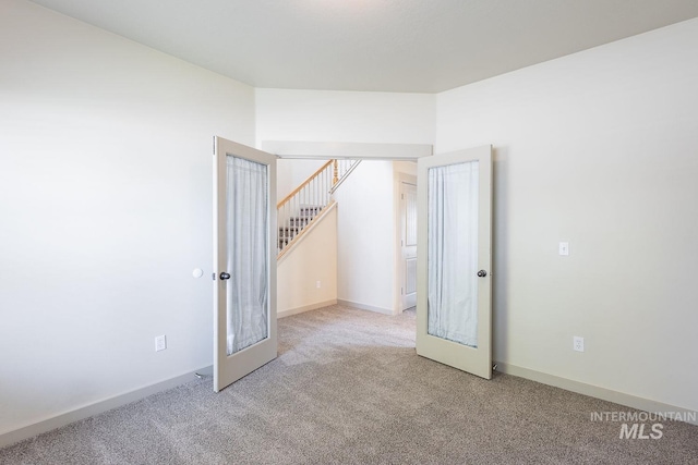 11965 Goldfinch St, Caldwell, ID 83605 - carpeted empty room featuring stairway and baseboards