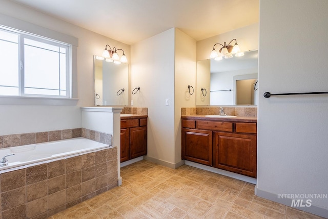 11965 Goldfinch St, Caldwell, ID 83605 - full bathroom featuring a garden tub and two vanities