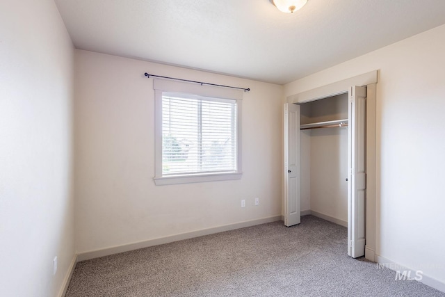 11965 Goldfinch St, Caldwell, ID 83605 - unfurnished bedroom featuring carpet floors, baseboards, and a closet